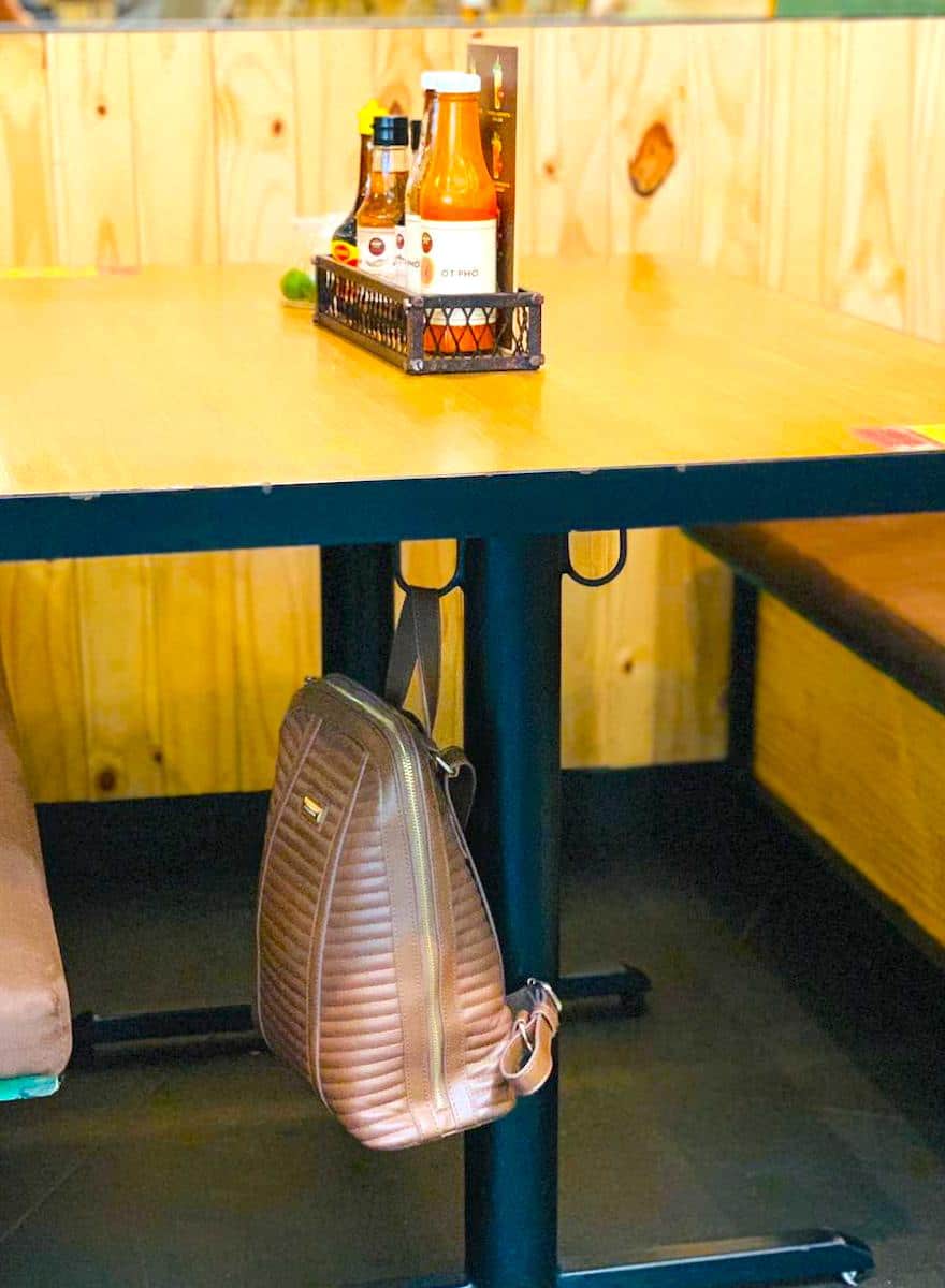 Charging stations/plug in and purse hook around bar - Picture of Queen Park  Social, Charlotte - Tripadvisor